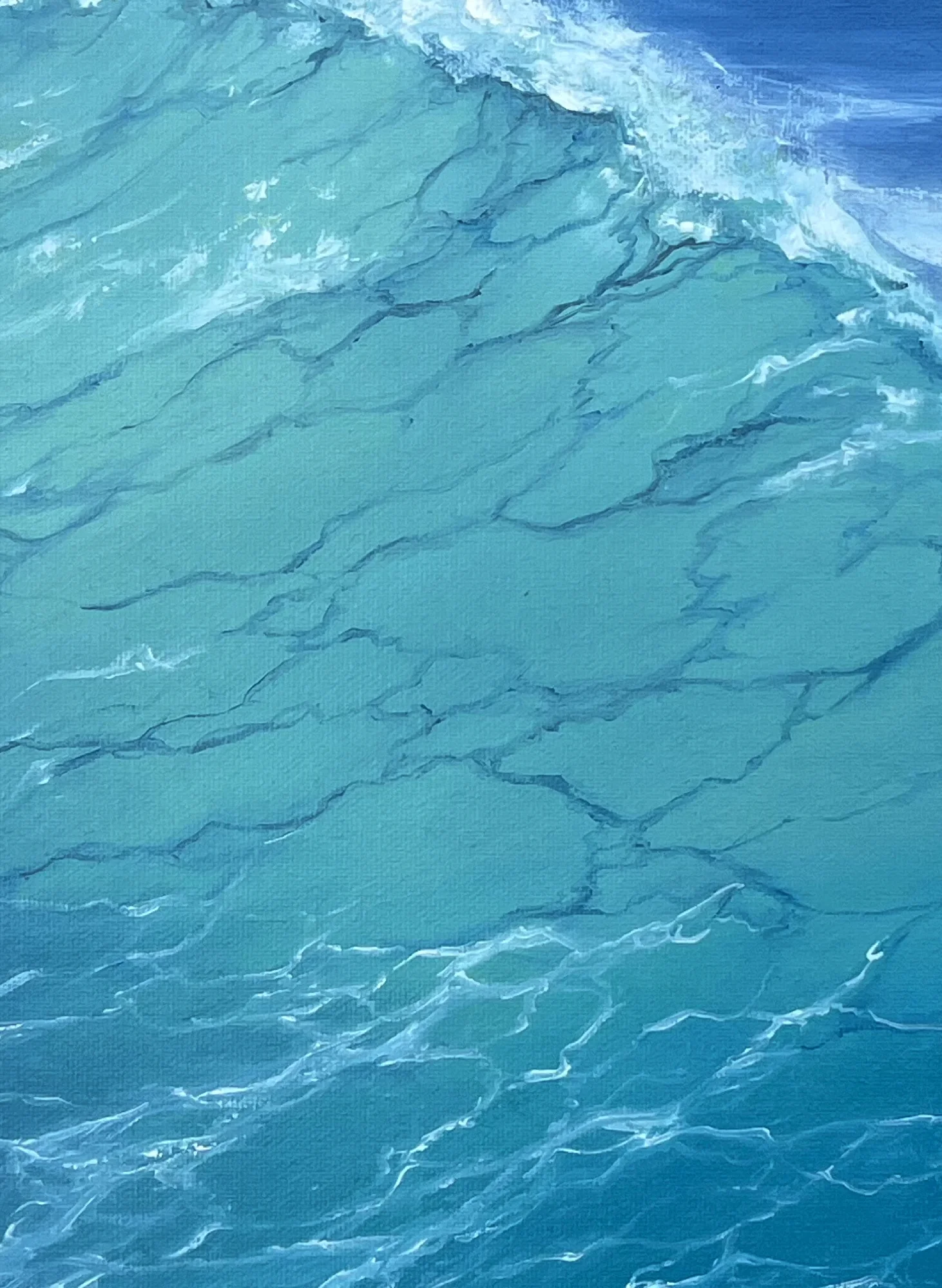 Close detail: the smooth turquoise face of a wave, veined with darker currents, foam breaking along its crest