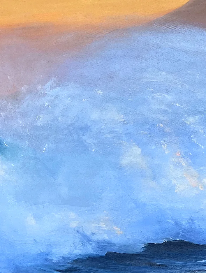 Close detail: a cloud of pale blue spray bursting up, touched with warm light from the sunset sky