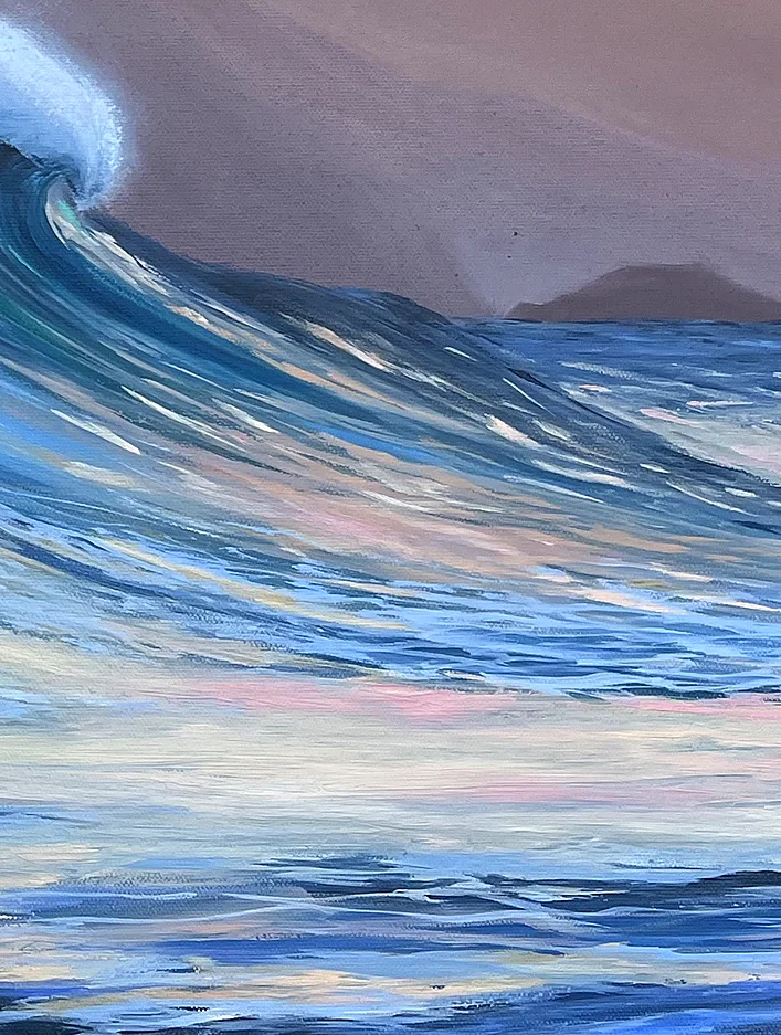 Close detail: long strokes of blue water shimmering with pink and gold reflections beneath the wave